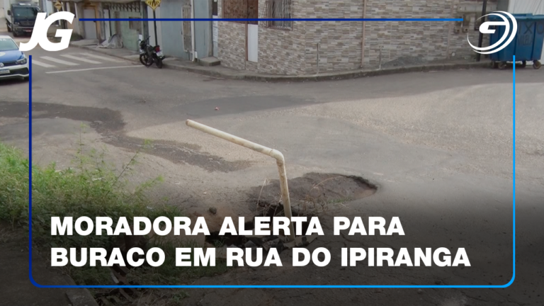ALÉM DO BURACO, ELA CHAMA ATENÇÃO PARA UM POSTE QUE ESTÁ SUSPENSO PELOS FIOS