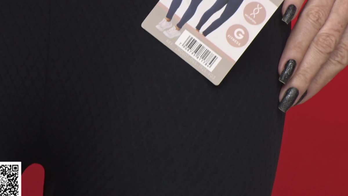 Detalhe da etiqueta e do tecido da legging fitness da Calêndula